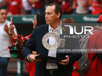 Horacio de la Vega, president of LMB, delivers the trophy of Champion South Zone of the Mexican Baseball League (LMB) to Diablos Rojos at th...