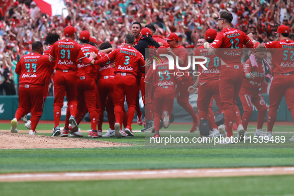 Diablos Rojos players celebrate at the end of match 7 of the Mexican Baseball League (LMB) South Zone 2024 championship series against Guerr...