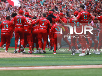 Diablos Rojos players celebrate at the end of match 7 of the Mexican Baseball League (LMB) South Zone 2024 championship series against Guerr...