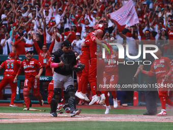 Diablos Rojos players celebrate at the end of match 7 of the Mexican Baseball League (LMB) South Zone 2024 championship series against Guerr...