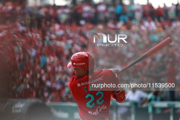 Robinson Cano #22 of Diablos Rojos bats during match 7 of the Mexican Baseball League (LMB) South Zone 2024 championship series against Guer...