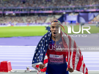 Roderick Townsend-Roberts of the United States of America reacts after he wins the gold medal during the Men's High Jump - T47 at Stade de F...