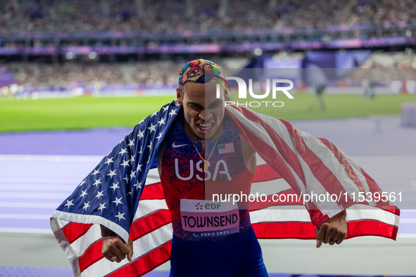 Roderick Townsend-Roberts of the United States of America reacts after he wins the gold medal during the Men's High Jump - T47 at Stade de F...