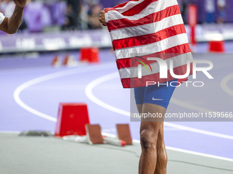 Roderick Townsend-Roberts of the United States of America reacts after he wins the gold medal during the Men's High Jump - T47 at Stade de F...