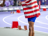 Roderick Townsend-Roberts of the United States of America reacts after he wins the gold medal during the Men's High Jump - T47 at Stade de F...