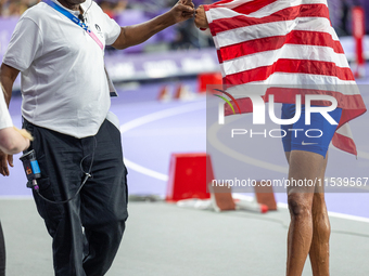 Roderick Townsend-Roberts of the United States of America reacts after he wins the gold medal during the Men's High Jump - T47 at Stade de F...