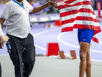 Roderick Townsend-Roberts of the United States of America reacts after he wins the gold medal during the Men's High Jump - T47 at Stade de F...