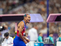 Roderick Townsend-Roberts of the United States of America reacts after he wins the gold medal during the Men's High Jump - T47 at Stade de F...