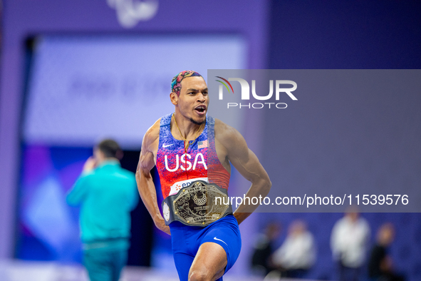 Roderick Townsend-Roberts of the United States of America reacts after he wins the gold medal during the Men's High Jump - T47 at Stade de F...