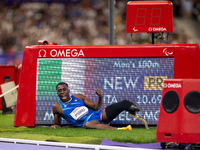 Maxcel Amo Manu of Italy reacts after he wins the Men's 100m - T64 Round 1 - Heat 2 with a personal best at Stade de France during the Paris...