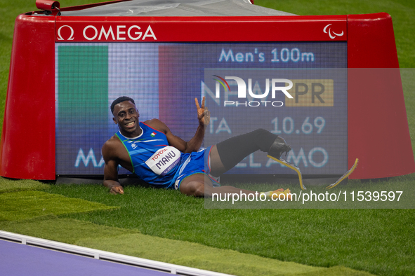 Maxcel Amo Manu of Italy reacts after he wins the Men's 100m - T64 Round 1 - Heat 2 with a personal best at Stade de France during the Paris...