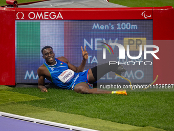 Maxcel Amo Manu of Italy reacts after he wins the Men's 100m - T64 Round 1 - Heat 2 with a personal best at Stade de France during the Paris...