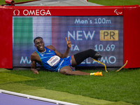 Maxcel Amo Manu of Italy reacts after he wins the Men's 100m - T64 Round 1 - Heat 2 with a personal best at Stade de France during the Paris...