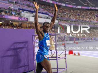 Maxcel Amo Manu of Italy reacts after he wins the Men's 100m - T64 Round 1 - Heat 2 with a personal best at Stade de France during the Paris...