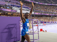 Maxcel Amo Manu of Italy reacts after he wins the Men's 100m - T64 Round 1 - Heat 2 with a personal best at Stade de France during the Paris...