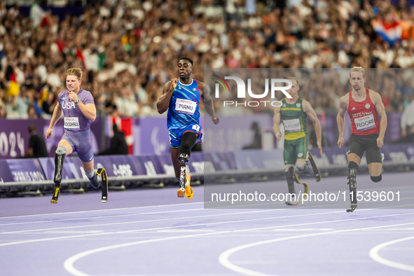 From left, Woodall of the USA, Maxcel Amo Manu of Italy, De Plessis of South Africa, and Floors of Germany compete during the Men's 100m - T...