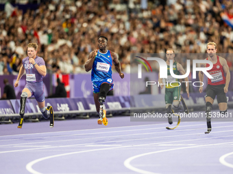 From left, Woodall of the USA, Maxcel Amo Manu of Italy, De Plessis of South Africa, and Floors of Germany compete during the Men's 100m - T...