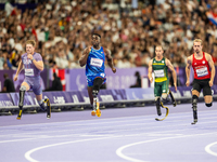 From left, Woodall of the USA, Maxcel Amo Manu of Italy, De Plessis of South Africa, and Floors of Germany compete during the Men's 100m - T...