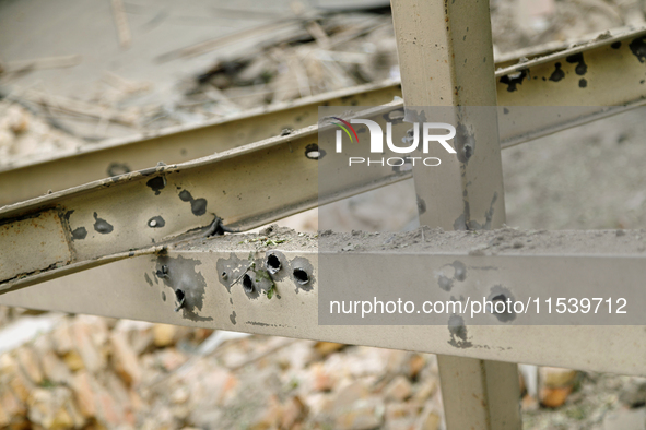 A piece of metal on Beresteiskyi Avenue is dotted with shrapnel holes after the Russian missile attack in Kyiv, Ukraine, on September 2, 202...