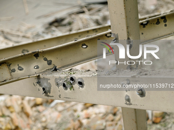 A piece of metal on Beresteiskyi Avenue is dotted with shrapnel holes after the Russian missile attack in Kyiv, Ukraine, on September 2, 202...