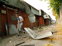 A man walks through the rubble at a building in the Sviatoshynskyi district damaged by the Russian missile attack in Kyiv, Ukraine, on Septe...