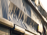 Damaged corrugated iron sheets are in the Sviatoshynskyi district after the Russian missile attack in Kyiv, Ukraine, on September 2, 2024. N...