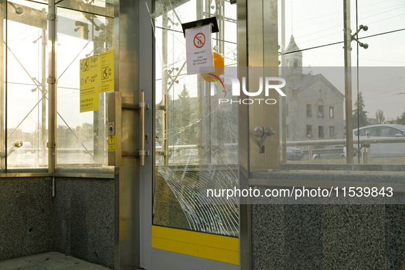 Cracked doors are at the Sviatoshyn metro station in the Sviatoshynskyi district after the Russian missile attack in Kyiv, Ukraine, on Septe...