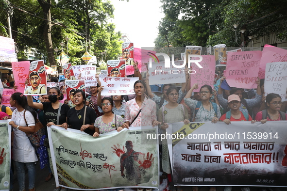 Medical students and doctors shout slogans during a protest rally towards Kolkata Police Headquarters, Lalbazar, protesting against the rape...