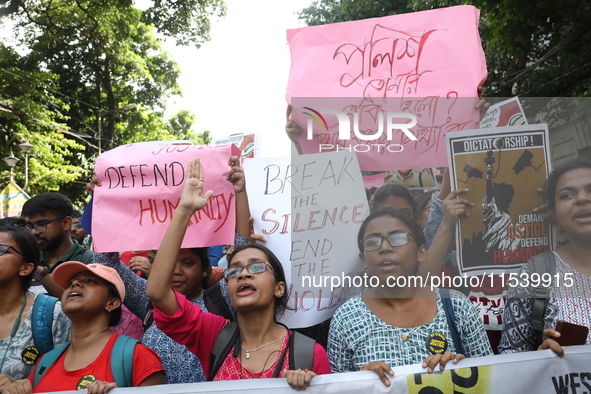 Medical students and doctors shout slogans during a protest rally towards Kolkata Police Headquarters, Lalbazar, protesting against the rape...