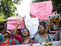 Medical students and doctors shout slogans during a protest rally towards Kolkata Police Headquarters, Lalbazar, protesting against the rape...