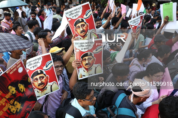 Medical students and doctors shout slogans during a protest rally towards Kolkata Police Headquarters, Lalbazar, protesting against the rape...