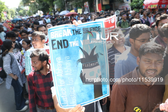 Medical students and doctors shout slogans during a protest rally towards Kolkata Police Headquarters, Lalbazar, protesting against the rape...