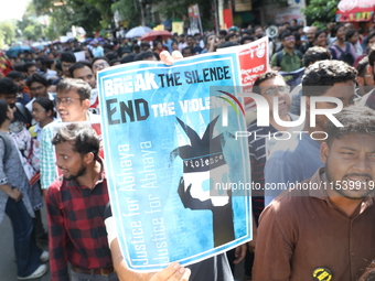 Medical students and doctors shout slogans during a protest rally towards Kolkata Police Headquarters, Lalbazar, protesting against the rape...