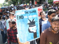 Medical students and doctors shout slogans during a protest rally towards Kolkata Police Headquarters, Lalbazar, protesting against the rape...