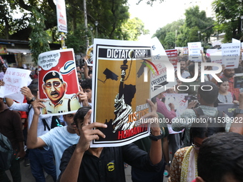 Medical students and doctors shout slogans during a protest rally towards Kolkata Police Headquarters, Lalbazar, protesting against the rape...