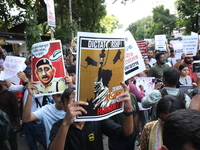 Medical students and doctors shout slogans during a protest rally towards Kolkata Police Headquarters, Lalbazar, protesting against the rape...