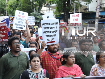 Medical students and doctors shout slogans during a protest rally towards Kolkata Police Headquarters, Lalbazar, protesting against the rape...