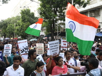 Medical students and doctors shout slogans during a protest rally towards Kolkata Police Headquarters, Lalbazar, protesting against the rape...