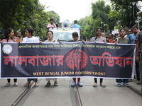 Medical students and doctors shout slogans during a protest rally towards Kolkata Police Headquarters, Lalbazar, protesting against the rape...