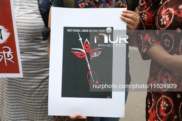 Medical students and doctors shout slogans during a protest rally towards Kolkata Police Headquarters, Lalbazar, protesting against the rape...