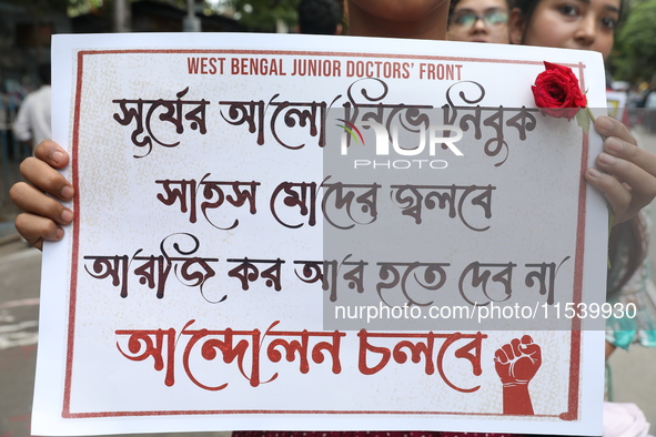 Medical students and doctors shout slogans during a protest rally towards Kolkata Police Headquarters, Lalbazar, protesting against the rape...