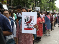 Medical students and doctors shout slogans during a protest rally towards Kolkata Police Headquarters, Lalbazar, protesting against the rape...