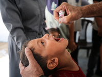 A Palestinian child receives a polio vaccination in the UK-MED field hospital in Zawayda, Gaza Strip, on September 2, 2024, amid the ongoing...