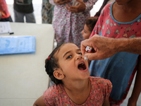 A Palestinian child receives a polio vaccination in the UK-MED field hospital in Zawayda, Gaza Strip, on September 2, 2024, amid the ongoing...