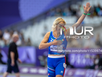 Valentina Petrillo of Team Italy reacts after qualifying for the finals in the Women's 400m T12 Heat 4 at Stade de France during the Paris 2...