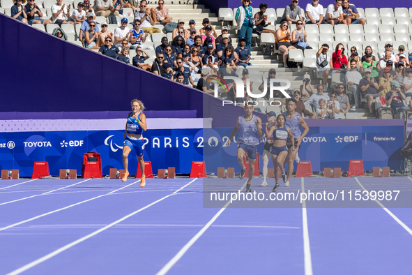 Valentina Petrillo of Team Italy competes in the Women's 400m T12 Heat 4 at Stade de France during the Paris 2024 Paralympic Games in Paris,...