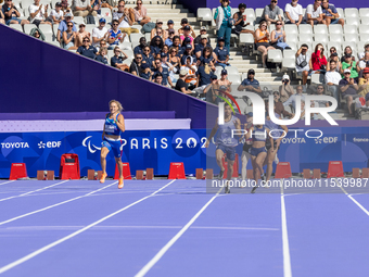 Valentina Petrillo of Team Italy competes in the Women's 400m T12 Heat 4 at Stade de France during the Paris 2024 Paralympic Games in Paris,...