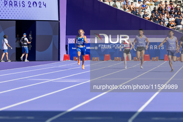 Valentina Petrillo of Team Italy competes in the Women's 400m T12 Heat 4 at Stade de France during the Paris 2024 Paralympic Games in Paris,...