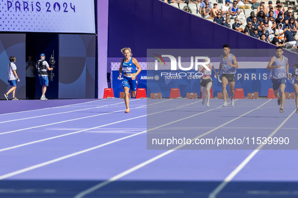 Valentina Petrillo of Team Italy competes in the Women's 400m T12 Heat 4 at Stade de France during the Paris 2024 Paralympic Games in Paris,...