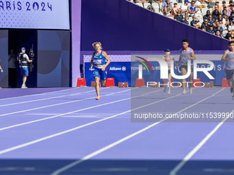 Valentina Petrillo of Team Italy competes in the Women's 400m T12 Heat 4 at Stade de France during the Paris 2024 Paralympic Games in Paris,...